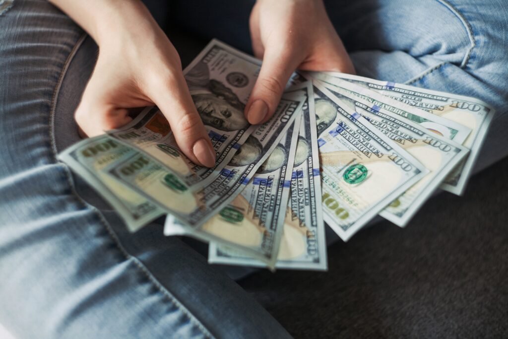 fan of 100 U.S. dollar banknotes fan of 100 U.S. dollar banknotes