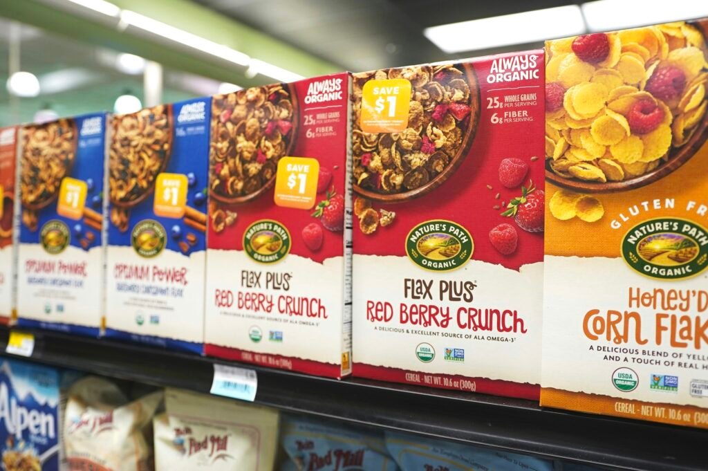 A store shelf filled with cereal and cereal A store shelf filled with cereal and cereal