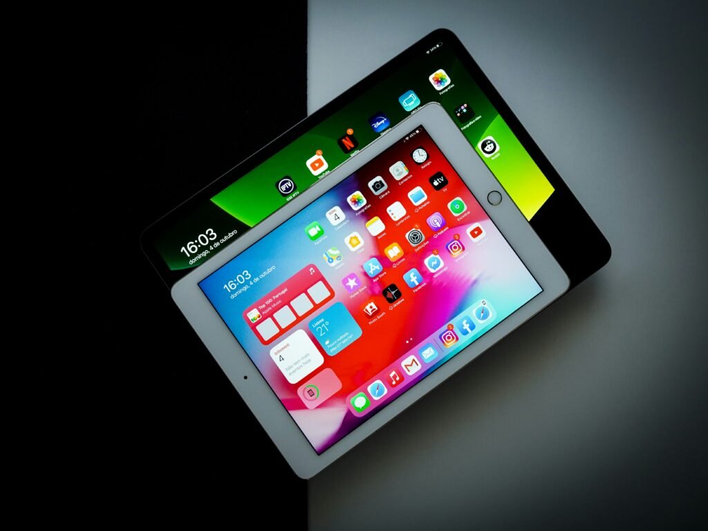 black ipad on white table black ipad on white table