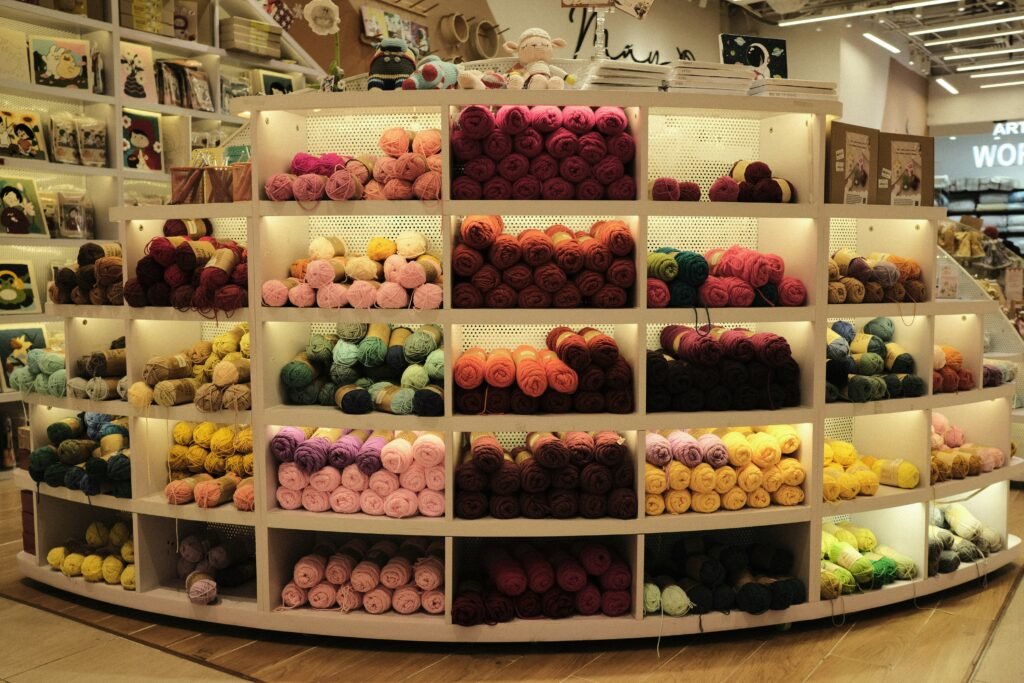 Shelves are filled with colorful balls of yarn.