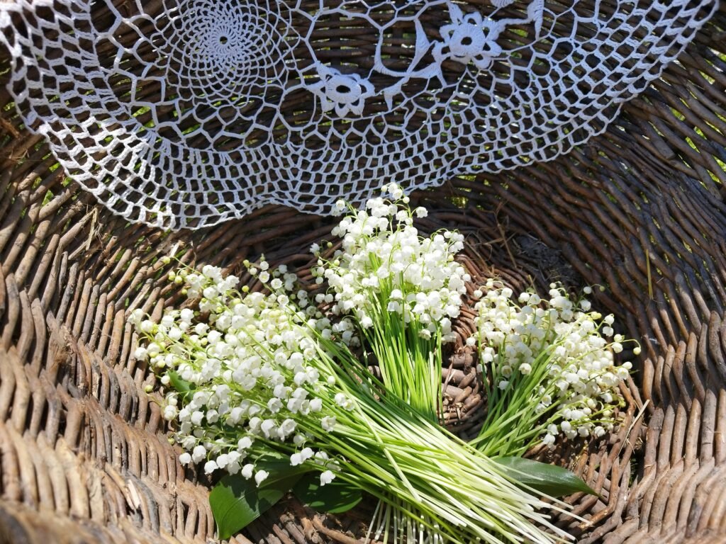 a bouquet of flowers sitting on top of a wicker basket