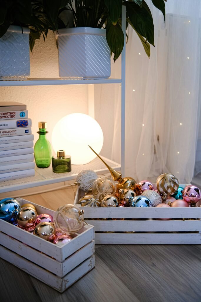 a couple of boxes filled with ornaments on top of a wooden floor
